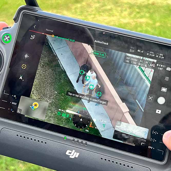 private investigator using drone for discreet high-altitude surveillance of individuals